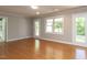 Bright living room with hardwood floors, recessed lighting, and multiple access points at 312 Heidinger Dr, Cary, NC 27511