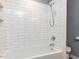 Image shows a shower with a white bathtub, white subway tile and a toilet at 312 Heidinger Dr, Cary, NC 27511