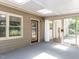Bright sunroom with skylight, patio access, and view to the backyard at 312 Heidinger Dr, Cary, NC 27511