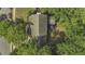 Aerial view of home with an umbrella covered patio surrounded by mature trees at 3204 Peachford Ln, Raleigh, NC 27616