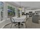 Cozy breakfast nook with large windows offering scenic backyard views at 3204 Peachford Ln, Raleigh, NC 27616