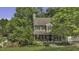 Charming two-story home with a well-manicured front yard and inviting front porch at 3204 Peachford Ln, Raleigh, NC 27616