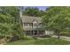 Classic two-story home with a well-maintained lawn and mature trees providing shade and curb appeal at 3204 Peachford Ln, Raleigh, NC 27616