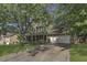 Traditional two-story home featuring an attached two-car garage and mature trees in a lush yard at 3204 Peachford Ln, Raleigh, NC 27616