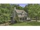 Beautiful two-story home surrounded by lush greenery providing privacy at 3204 Peachford Ln, Raleigh, NC 27616