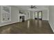 Spacious living room featuring hardwood floors, fireplace, and ample natural light at 3204 Peachford Ln, Raleigh, NC 27616