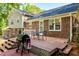 Cozy back deck with a grill and outdoor seating, perfect for entertaining and enjoying the private backyard at 3301 Manor Ridge Dr, Raleigh, NC 27603