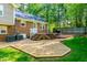 Large backyard featuring a patio, a deck with outdoor seating, a grill and a well-manicured lawn at 3301 Manor Ridge Dr, Raleigh, NC 27603