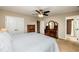 Comfortable bedroom with neutral colors, a ceiling fan, and closet, creating a cozy and inviting space at 3301 Manor Ridge Dr, Raleigh, NC 27603