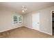 Neutral bedroom with a ceiling fan and large window to let in the natural light at 3301 Manor Ridge Dr, Raleigh, NC 27603