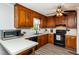 Traditional kitchen with wood cabinets, white countertops, and modern appliances at 3301 Manor Ridge Dr, Raleigh, NC 27603