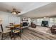 Spacious living area with a decorative fireplace, adjacent dining space, and lots of natural light at 3301 Manor Ridge Dr, Raleigh, NC 27603