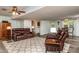 Open-concept living room featuring a cozy seating area and a dining space, enhanced by natural light at 3301 Manor Ridge Dr, Raleigh, NC 27603