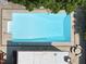 A top-down aerial view of the pool and the adjacent patio area and house at 3704 Swann St, Raleigh, NC 27612