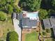 An aerial view of the property showing the pool, patio, landscaping, and house at 3704 Swann St, Raleigh, NC 27612