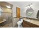 Well-appointed bathroom featuring a tiled walk-in shower, granite vanity, and sleek fixtures at 3704 Swann St, Raleigh, NC 27612
