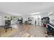 Spacious bonus room featuring wood flooring, skylights, and a flexible layout for various activities at 3704 Swann St, Raleigh, NC 27612
