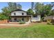 Charming home with a well-manicured lawn and inviting yellow door at 3704 Swann St, Raleigh, NC 27612