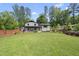 Charming two-story home with a beautifully landscaped front yard and a welcoming front porch at 3704 Swann St, Raleigh, NC 27612