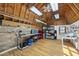 Spacious garage with wood plank ceiling, workbench, and ample storage at 3704 Swann St, Raleigh, NC 27612