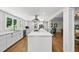 Bright, open kitchen seamlessly connecting to the living/dining area, perfect for entertaining at 3704 Swann St, Raleigh, NC 27612
