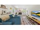 Living room with a fireplace, walkout access, and colorful furnishings at 3704 Swann St, Raleigh, NC 27612