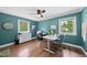 Bright home office with hardwood floors, modern lighting, and ample workspace at 3704 Swann St, Raleigh, NC 27612