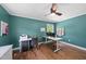 Home office with hardwood floors, natural lighting, and a ceiling fan at 3704 Swann St, Raleigh, NC 27612