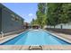 Outdoor in-ground swimming pool and shaded gazebo with outdoor dining area at 3704 Swann St, Raleigh, NC 27612