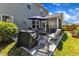 Outdoor patio with furniture, grill, and view of the fenced backyard at 3801 Althorp Dr, Raleigh, NC 27616