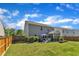 Landscaped backyard with privacy fence, spacious lawn, and screened-in porch at 3801 Althorp Dr, Raleigh, NC 27616