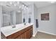 Bright bathroom features double sinks, a spacious mirror, and a shower at 3801 Althorp Dr, Raleigh, NC 27616
