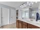 Bathroom features double sink vanity, large mirror, and easy access to bedroom and shower at 3801 Althorp Dr, Raleigh, NC 27616