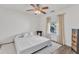 Bright bedroom with white walls, ceiling fan, and natural light from the window at 3801 Althorp Dr, Raleigh, NC 27616