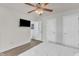 Bright bedroom with hardwood floors, closet, and ceiling fan at 3801 Althorp Dr, Raleigh, NC 27616