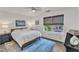 Bedroom featuring white walls, wood look floors, and a large window with shades at 3801 Althorp Dr, Raleigh, NC 27616