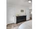 Bedroom with wood-look floors, white walls, and black dresser at 3801 Althorp Dr, Raleigh, NC 27616