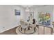 Cozy dining area with a round table, chandelier, and sliding glass doors to the outdoor space at 3801 Althorp Dr, Raleigh, NC 27616