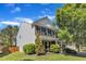 Beautiful two-story home features a brick and siding facade, lush landscaping, and a cozy front porch at 3801 Althorp Dr, Raleigh, NC 27616