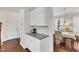 Transitional space with countertop, white cabinets, and views into the dining room at 3801 Althorp Dr, Raleigh, NC 27616