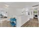 Upstairs hallway features wood-look floors, lots of light, and a laundry area at 3801 Althorp Dr, Raleigh, NC 27616