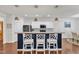 Bright kitchen boasts granite countertops, a breakfast bar with seating, and stainless steel appliances at 3801 Althorp Dr, Raleigh, NC 27616