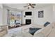 Cozy living room with fireplace, TV, and comfortable seating at 3801 Althorp Dr, Raleigh, NC 27616