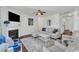 Bright living room featuring plush seating, a fireplace, ceiling fan, and neutral decor at 3801 Althorp Dr, Raleigh, NC 27616