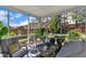 Cozy screened-in porch featuring comfortable seating and views of the landscaped backyard at 3801 Althorp Dr, Raleigh, NC 27616
