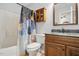 Bathroom featuring vanity, mirror, and a shower with a decorative shower curtain at 3808 Hopper St, Raleigh, NC 27616