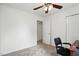 Bright bedroom featuring neutral walls and carpet, with a ceiling fan and closet at 3808 Hopper St, Raleigh, NC 27616