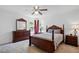 Bedroom with wood furniture set including bed, dresser, and nightstands near a window at 3808 Hopper St, Raleigh, NC 27616