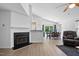 Open-concept dining area with modern light fixture, and access to backyard at 3808 Hopper St, Raleigh, NC 27616