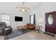 Spacious living room with ample seating, natural light, and view of the entry door at 3808 Hopper St, Raleigh, NC 27616
